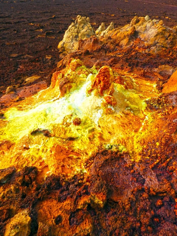 pexels-photo-12258551 Colorful sulfur formations at Dallol in Ethiopia's Afar region, showcasing extreme volcanic terrain.